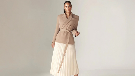 a woman in structured jacket and midi dress